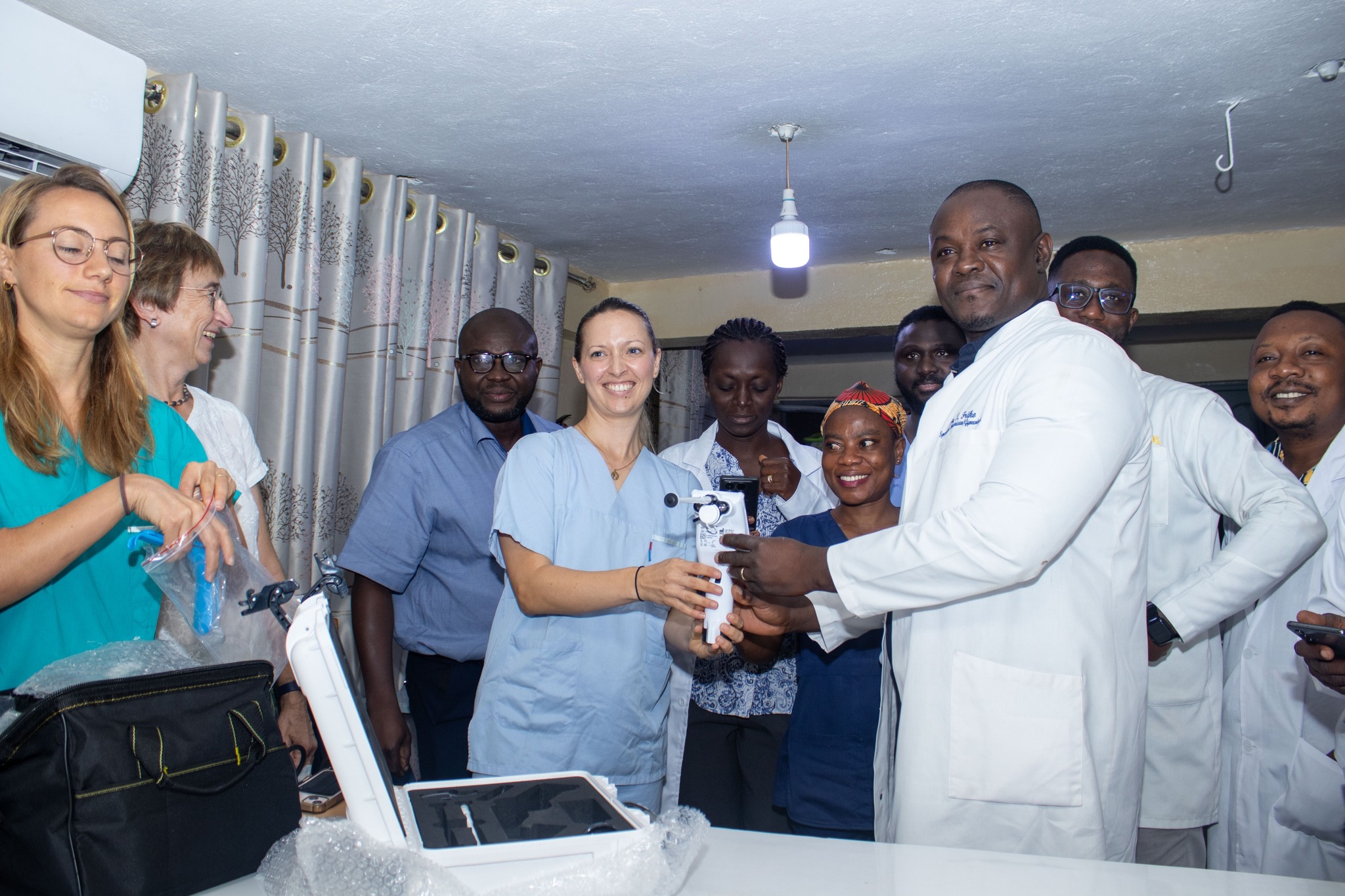 <p>Dr. Nadja donating a medical device to the OBGY Team</p>
